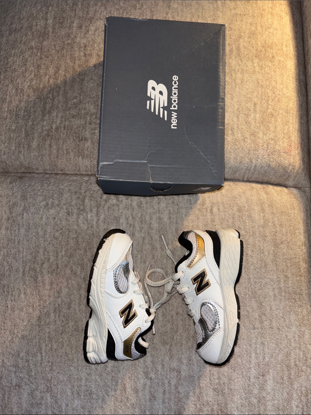 New Balance Kids White Sneakers with Gold and Black Accents